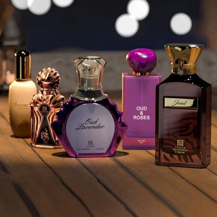 Luxury Middle Eastern perfumes including Oud Lavender and Oud & Roses on wooden display