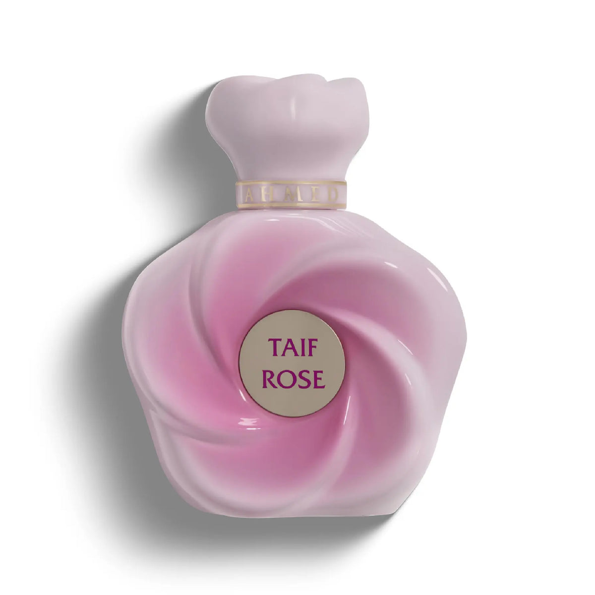 Elegant light pink, flower-shaped perfume bottle with a central Taif Rose label and smooth, sculpted glass petals.